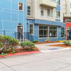 Find your perfect fit at Viv a blue building with bushes in front of it