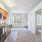a kitchen with a refrigerator and cabinets