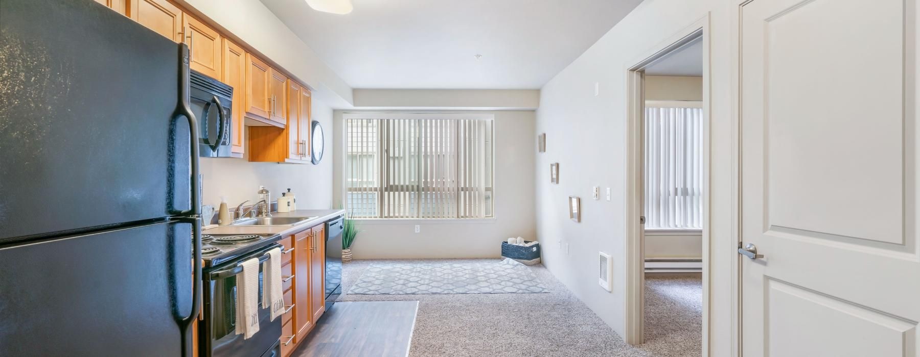 a kitchen with a refrigerator and cabinets